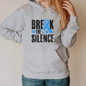 A woman wearing a hoodie with the words " break the silence ".