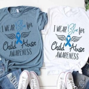 Two shirts that say i wear blue for child abuse awareness.